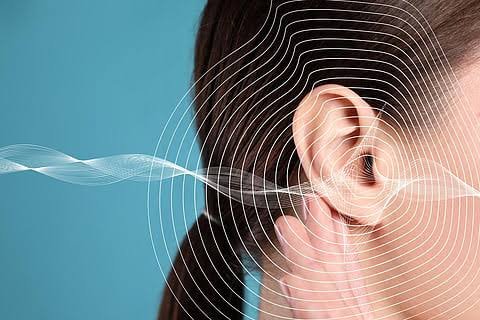 Illustration of sound waves entering female ear representing tinnitus and frequency sensitivity at Center of ENT Lahore