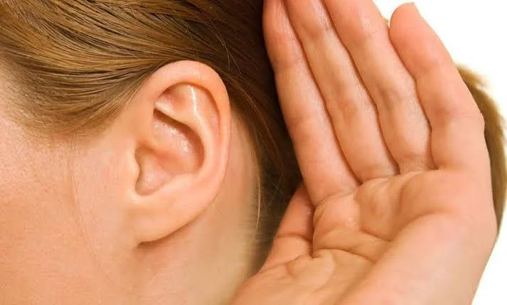 Patient cupping hand behind ear showing hearing loss symptoms at Center of ENT Lahore