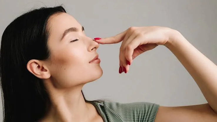 Woman touching nose profile evaluating deviated septum and septoplasty results at Center of ENT Lahore